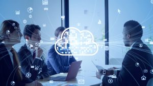 Four people brainstorming in a blueish room